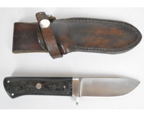 Rory Conner Irish hunting knife with composite grips and signed 10cm steel blade, in leather sheath.&nbsp;PLEASE NOTE: WE ARE
