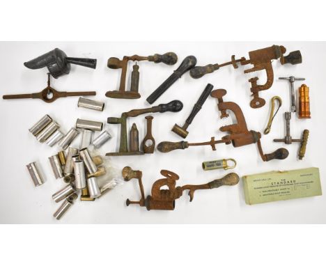 A collection of shotgun or rifle cartridge re-loading tools and gun accessories including roll turnover tools, cappers/ de-ca