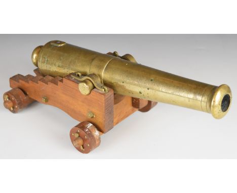 Bronze desk or signalling cannon each, 13 inch graduated barrel on wooden carriage, 35cm long.