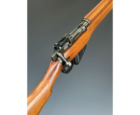 Lee Enfield No 4 Mk 1 .303 bolt-action rifle with framed stamped '1945', receiver stamped 'No.4 Mk 1', adjustable pop-up targ