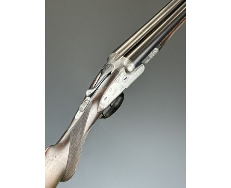 Baker Gun Co Paragon 16&nbsp;bore side by side sidelock shotgun with engraved scenes of dogs and birds to the named locks, en