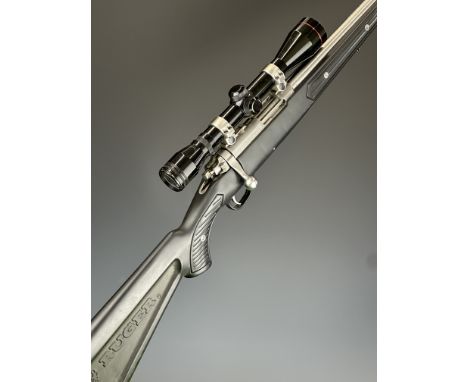 Ruger Model 77/22 .22 semi-automatic rifle with named composite stock, multi-shot magazine, sling mounts, scope, sound modera