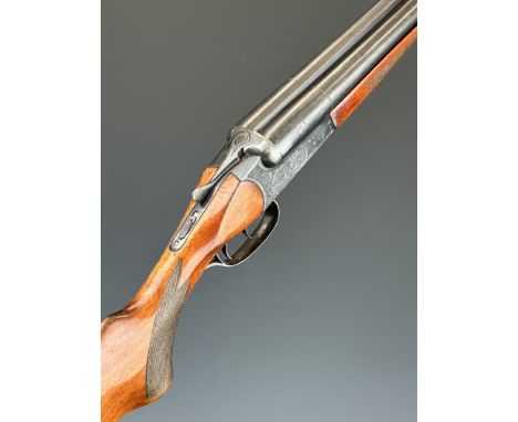 Baikal IJ-58 MAE 12 bore side by side ejector shotgun with heavy engraving of birds and rabbits to the locks, chequered semi-