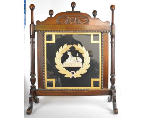 Wooden fire screen with glazed central panel wool/silk work of a sphinx superscribed Egypt inside a wreath. possibly Gloucest
