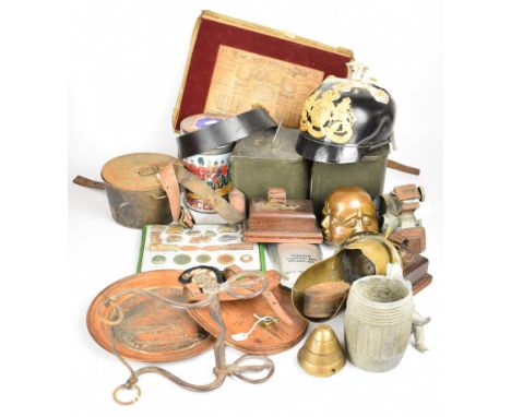 Collection of militaria including two tea caddies both marked with broad arrow mark and dated 1956, replica pickelhaube, hors