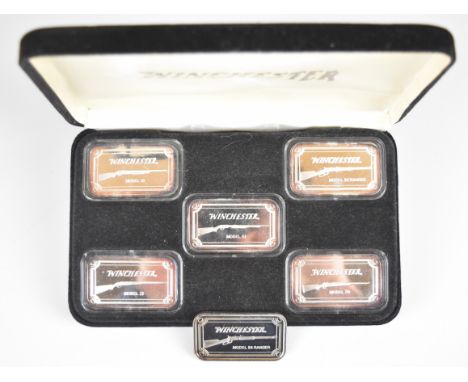 Six 1oz 999 fine silver ingots each featuring a Winchester shotgun or rifle, five in fitted case.&nbsp;