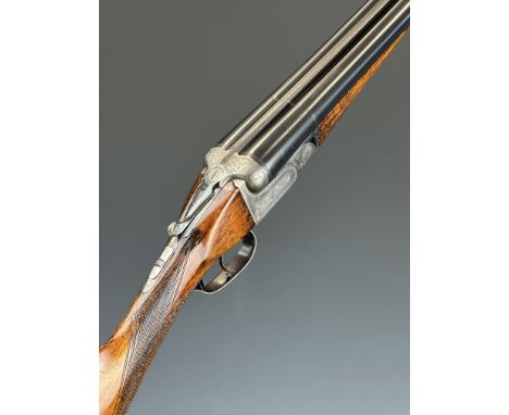 Beretta 12 bore side by side shotgun with engraved lock, underside, trigger guard, top plate, thumb lever and fences, chequer