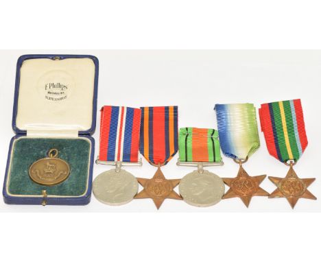 Five WW2 medals comprising Pacific Star, Burma Star, Atlantic Star, Defence Medal and War Medal, together with a Football Med