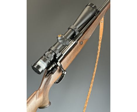 Parker-Hale .243 Winchester bolt-action rifle with chequered semi-pistol grip and forend, raised cheek piece, braided leather