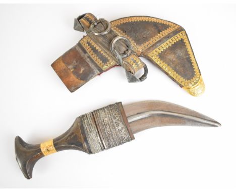 Middle Eastern Jambiya dagger with rhino or similar horn handle yellow and white metal decoration, leather covered wooden sca