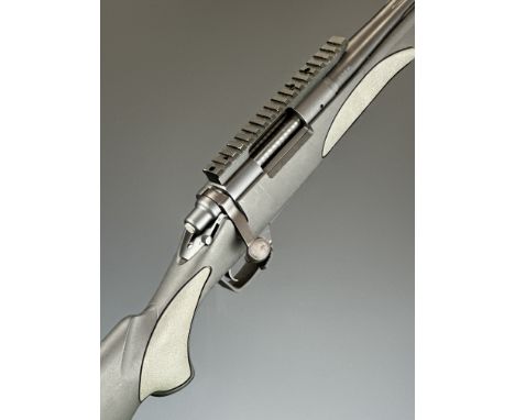 Remington Model 700 .223 bolt-action rifle with composite stock, textured semi-pistol grip and forend, raised cheek piece, sc