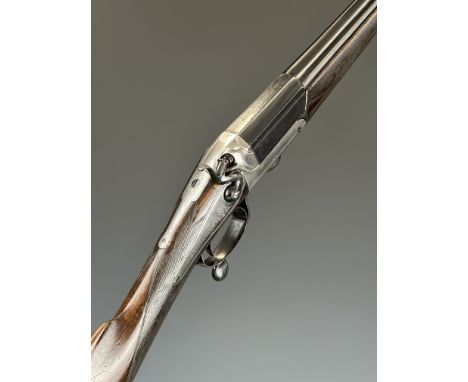 John Rigby &amp; Co 12 bore hammer action shotgun with named and engraved lock, engraved hammer, rotary underlever and top st