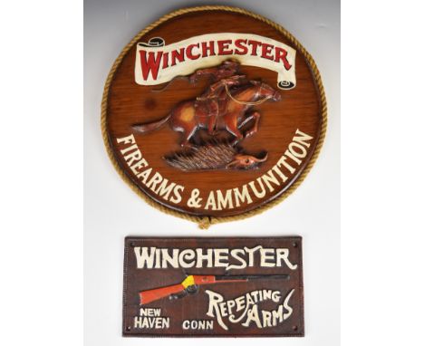 Two Winchester shop display or advertising signs, one Winchester Repeating Arms cast iron and one Winchester Firearms &amp; A