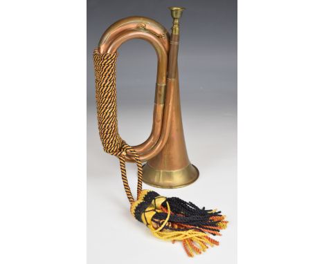Copper and brass bugle with coloured rope and tassels, overall length 28cm