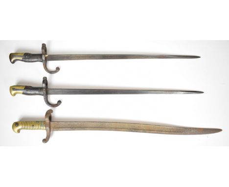 Two French 1874 pattern Gras bayonets, one with 1895 manufacture date, together with an 1842 pattern bayonet with brass grip 