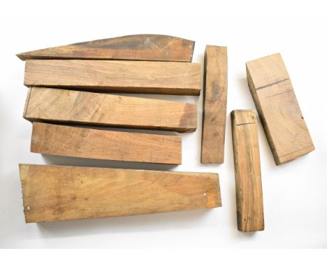 Eight figured walnut shotgun or rifle stock, forend and stock extension blanks, the stock blanks largest 37cm long.&nbsp;