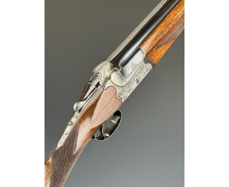 AYA Coral 12 bore over and under ejector shotgun with heavily carved action featuring scenes of dogs and birds, engraved unde