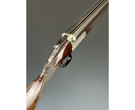 Winchester 12 bore side by side ejector shotgun with named and engraved lock, engraved underside, trigger guard, top plate an