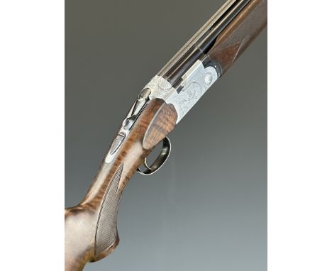 Beretta Model S687 Sporting 12 bore over and under ejector shotgun with engraved scenes of birds to the locks and underside, 