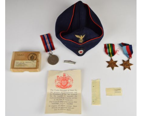 Three WW2 medals comprising 1939/1946 Star, Pacific Star and War Medal, attributed to 1163540 Cpl Baldwin, with postal box ad