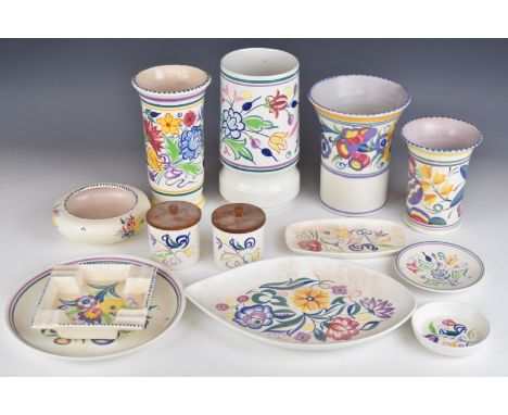 Collection of Poole pottery including four vases, dishes, trays and storage jars, one with Carter Stabler Adams mark, tallest