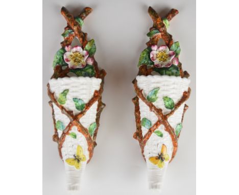 A pair of majolica style Victorian Brown Westhead Moore / George Jones or similar ceramic wall pockets decorated with butterf