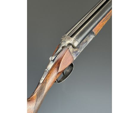 Laurona 12 bore side by side shotgun with engraved locks, underside, trigger guard, top plate, thumb lever and fences, cheque