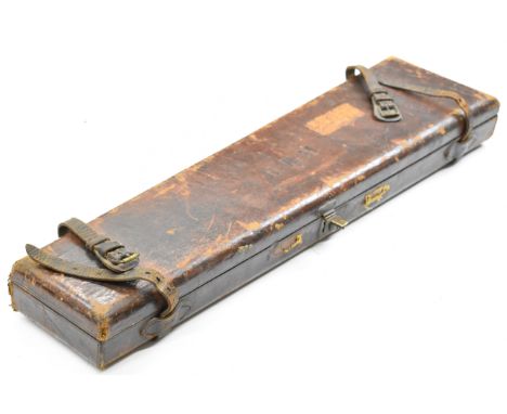 Two leather shotgun cases, one a leather and brass bound oak example with fitted interior and 'Harrods Ltd Gun and Rifle Dept