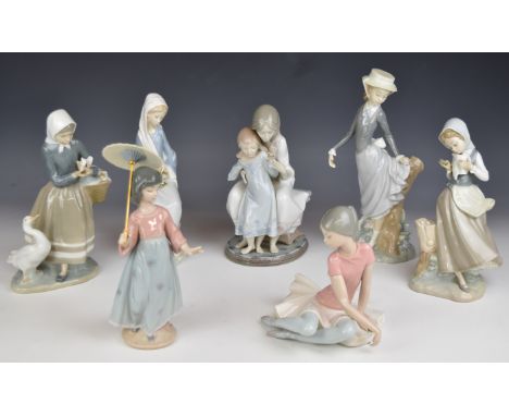 Seven Lladro figurines including ballerina, girl with umbrella and mother &amp; daughter, tallest 25cm