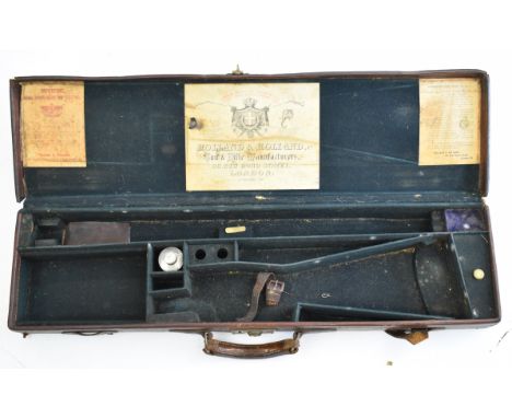 Leather bound shotgun case with Holland &amp; Holland oil bottle, fitted interior and three labels including 'Holland &amp; H