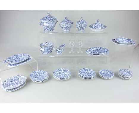 A 19th century Davenport part toy or miniature dinner service, with blue floral decoration on white ground, comprising four l