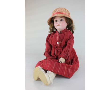 A Max Handwerck bisque head doll with brown hair, sleeping brown eyes and open mouth, marked 283/265 Max Handwerck Germany, o