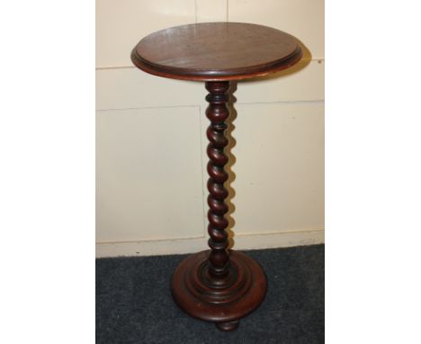 A circular mahogany pedestal table with reeded top, and barley twist stem, on stepped circular base and button feet, 34cm