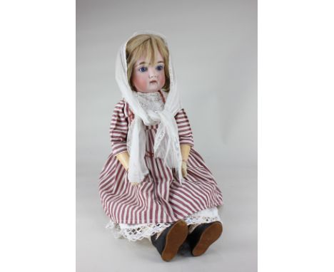 A bisque head doll, possibly Kammer & Reinhardt, with blonde wig, blue sleeping eyes and open mouth, marked 192 (two holes) 1