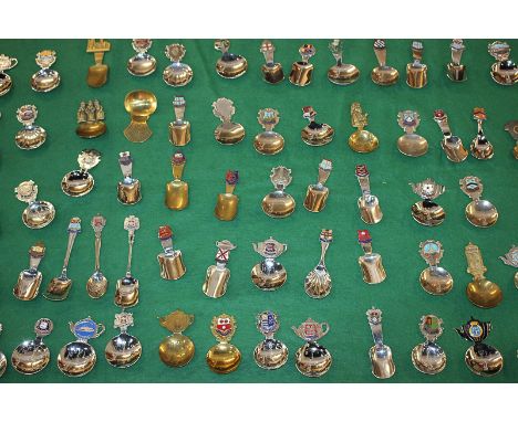 A large collection of collectors and commemorative caddy spoons, brass and silver plated