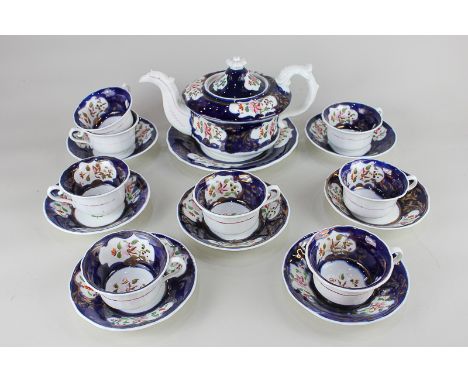 A Gaudy Welsh porcelain tea set comprising teapot with plate, eight teacups and seven saucers