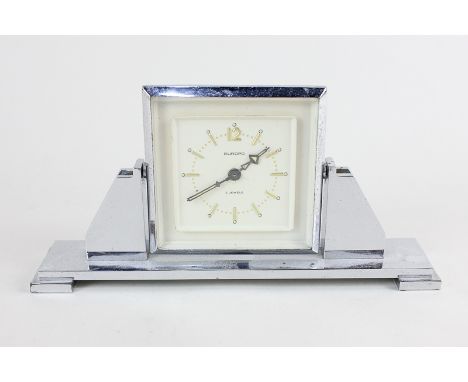 A Smiths Art Deco Europa mantel clock, the cream dial with Arabic numerals, on silverised rotating stand, 9cm high