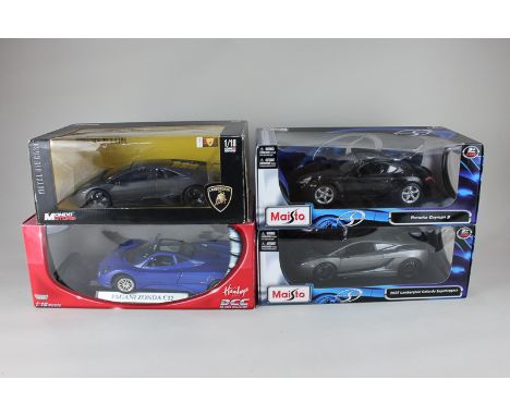 Two boxed Maisto Special Edition 1 : 18 scale models of a Porsche Cayman S and 2007 Lamborghini Gallardo Superleggera, a Haml