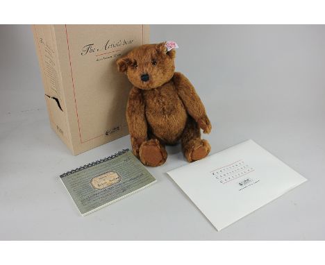 A Steiff dark brown mohair hump back teddy bear, The Artist's Bear, with ear tag, limited edition 613/2500, 27cm, with certif