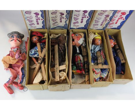 Five Pelham standard puppets comprising a wolf, a clown, Red Riding Hood, a policeman and Mac Boozel, boxed, together with a 