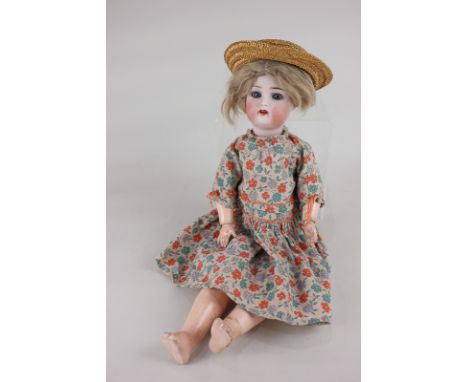 A Simon & Halbig bisque head doll with cut blonde wig, sleeping blue eyes and open mouth, marked Simon & Halbig, K (star) R, 