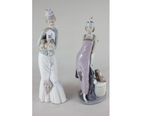 A Lladro porcelain figure of a lady holding a Pekinese dog, 37cm, and another Lladro figure of a lady in flapper costume besi