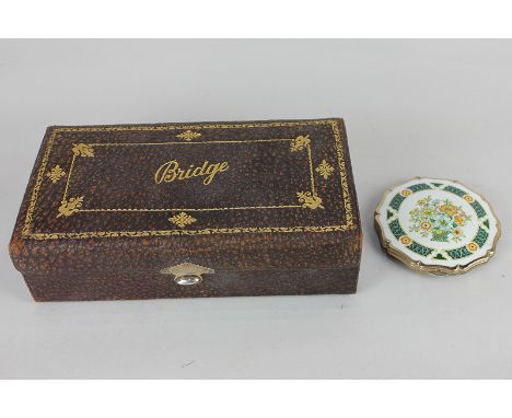 A 1920's bridge set with George V silver clasp, and a Stratton compact