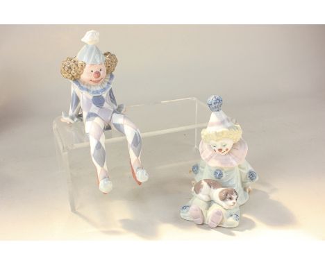 Two Lladro porcelain figures of clowns, one with puppy on his lap, 12cm