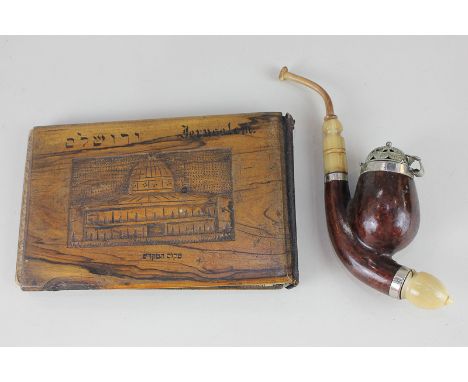 An early 20th century German smoking pipe stamped Bruyere Garantie (guaranteed briar), also initialled JE with carved horn st