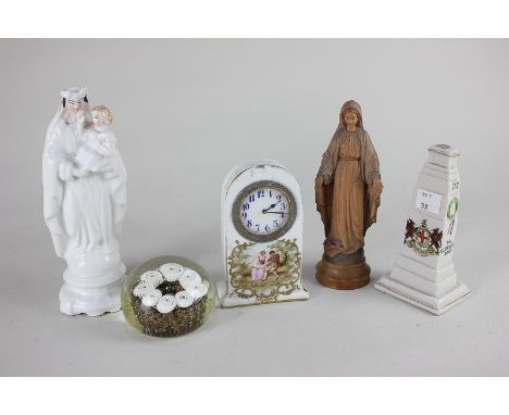 A small porcelain mantel clock with white 5cm dial, in domed porcelain case decorated with figures, 12cm, a crested porcelain