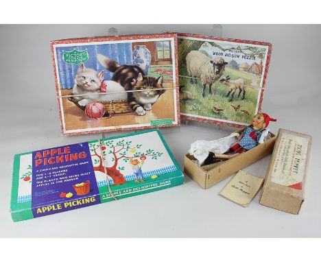 Two 'Victory' wooden jigsaw puzzles depicting sheep with lambs and two kittens in a basket, both boxed, together with a Picot