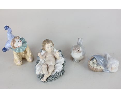 A Lladro porcelain figure of Jesus in a manger, together with a Nao clown, a Lladro duck group, and a Lladro wren 