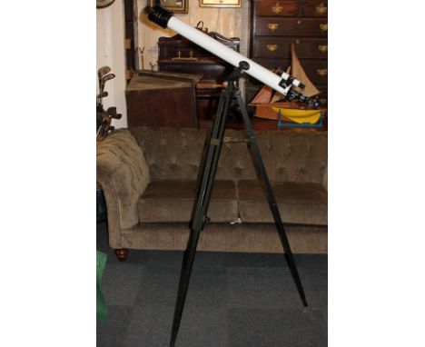 A model telescope, on tripod stand, with accessories