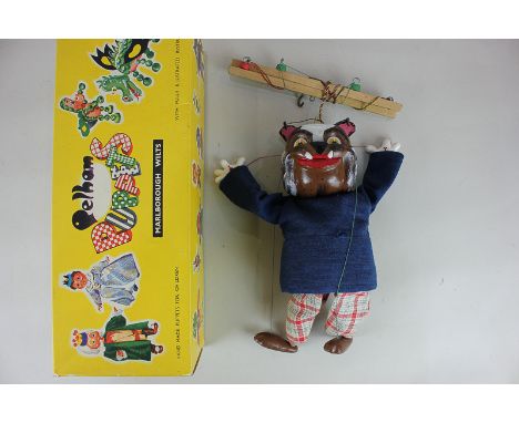 A Pelham puppet of a bulldog,dressed in blue sweater and checked trousers, boxed